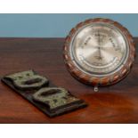 A compensated marine aneroid barometer together with an Arts & Crafts mahogany adjustable book slide