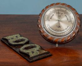 A compensated marine aneroid barometer together with an Arts & Crafts mahogany adjustable book slide
