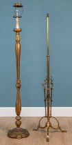 A gilt carved wood lamp standard together with a Victorian brass lamp standard