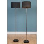 A pair of contemporary floor standing lamps