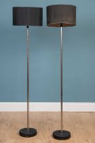 A pair of contemporary floor standing lamps