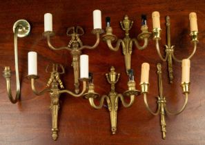 Three pairs of brass two-light wall brackets