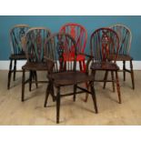 A group of six wheel-back Windsor kitchen chairs