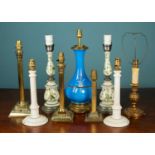A collection of nine table lamps to include a Chinese style cobalt blue porcelain lamp with brass