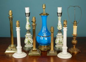 A collection of nine table lamps to include a Chinese style cobalt blue porcelain lamp with brass