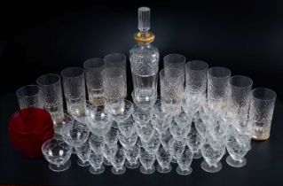 A set of twelve cut glass whisky tumblers together with a similar decanter; together with a set of g