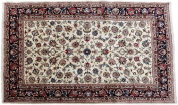 A cream ground Meshed rug