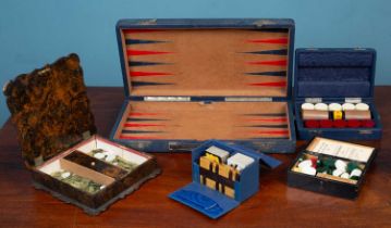 A 19th century lacquered tabletop games box together with other games