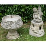 A cast reconstituted stone fountain together with a cast reconstituted stone urn on plinth
