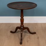 A Georgian style mahogany circular tilt top tripod table