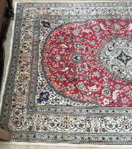 A red ground Oriental rug