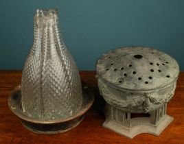 A group of six cut glass clustered decanters in a large coster; together with a brass potpourri vase