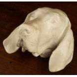 A cast plaster wall mounted dogs head