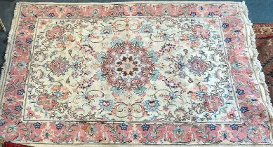 A cream ground Oriental rug