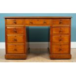 A mahogany partners desk with leather inset top