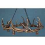 A chandelier or electrolier made from a ring of deer antlers