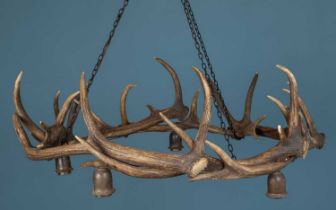 A chandelier or electrolier made from a ring of deer antlers