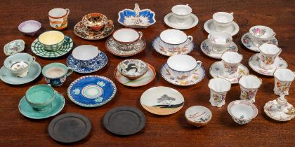 A collection of coffee cups and other ceramic wares