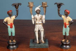Three bronze figural candlesticks