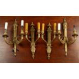 Two pairs of classically styled brass two-light wall brackets