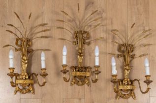 A set of three contemporary gilt carved wooden toleware wall lights