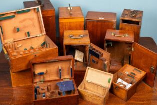 A collection of sixteen wooden microscope boxes