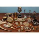 A collection of metalware to include a brass Art Deco desk stand; a brass bell with wood turned