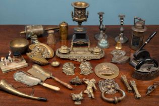 A collection of metalware to include a brass Art Deco desk stand; a brass bell with wood turned