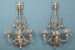 A pair of white painted toleware three-branch wall lights