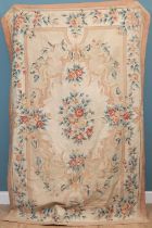 An Aubusson style cream ground needlework rug