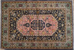 An Oriental Quom rug