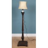 An Edwardian mahogany standard lamp