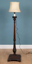 An Edwardian mahogany standard lamp