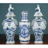 A pair of Dutch Delft tin-glazed vases; together with another Dutch Delftware vase