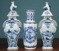 A pair of Dutch Delft tin-glazed vases; together with another Dutch Delftware vase