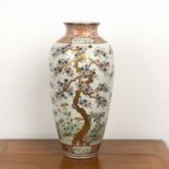 Polychrome porcelain vase Japanese, circa 1900, painted with pine trees in the Ko-Imari palette,