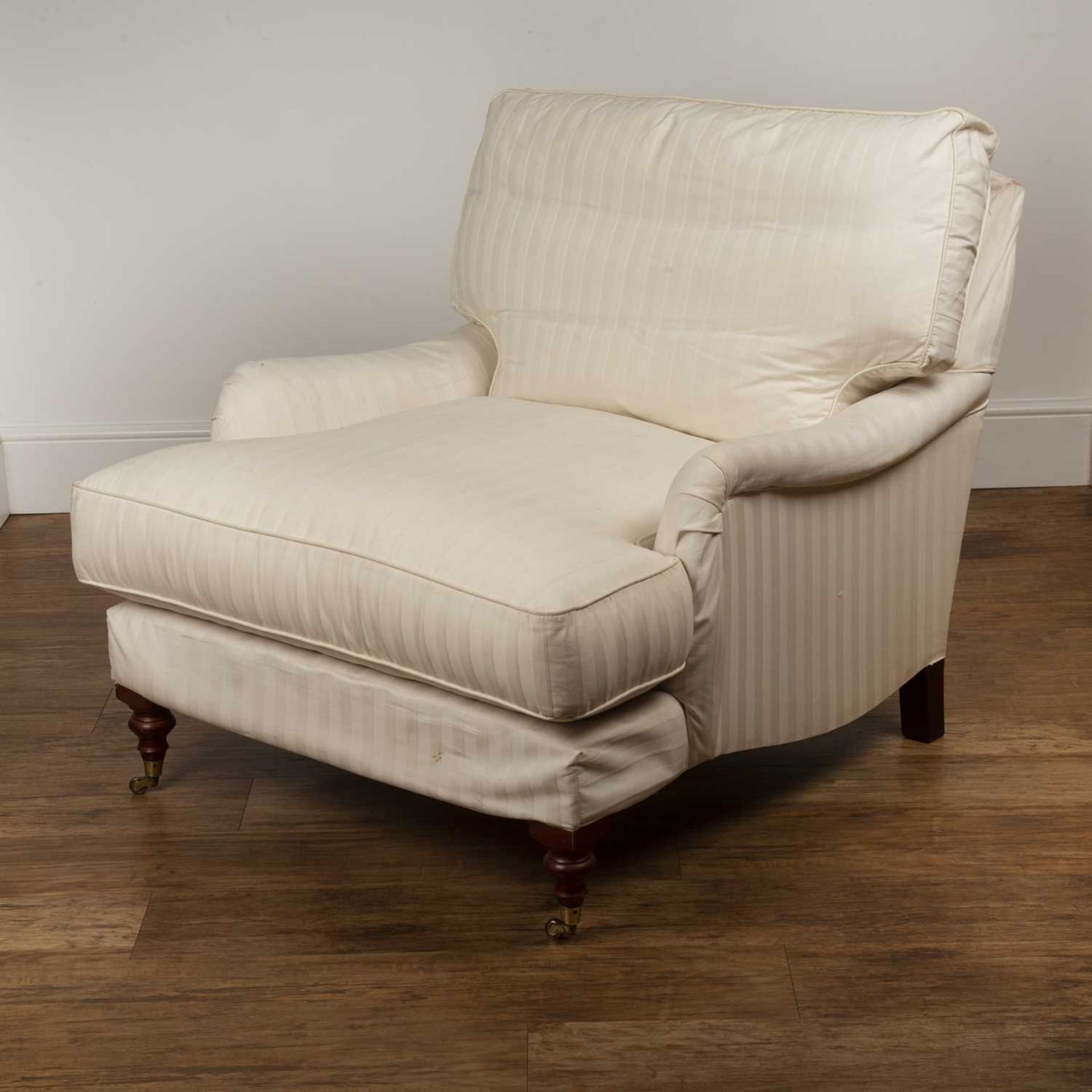 Howard style armchair Contemporary, with white striped upholstery, on brass castors, 86cm wide - Image 3 of 5