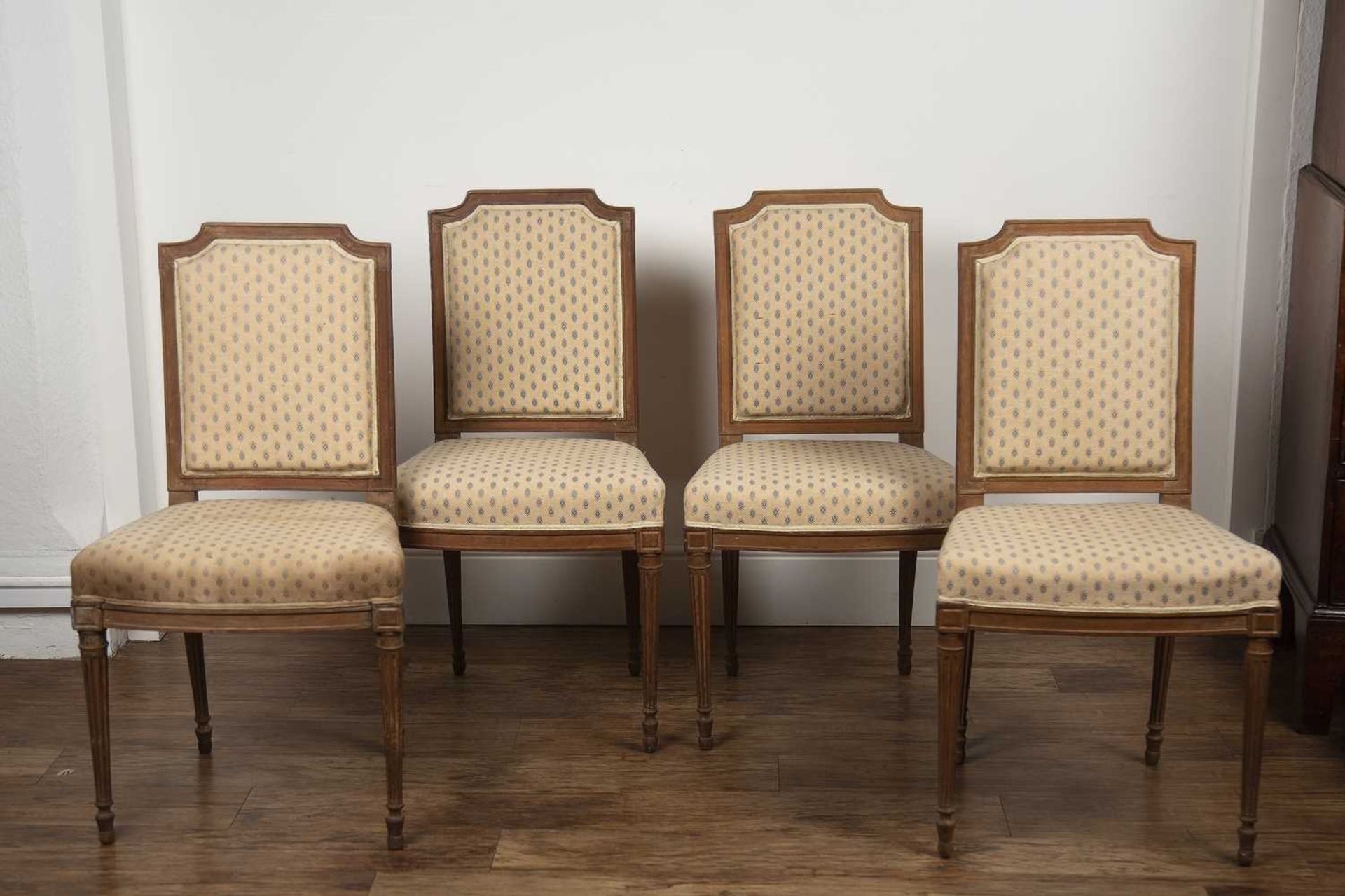 Set of four French Louis XVI style chairs with cream and blue upholstery on reeded legs, 90.5cm high