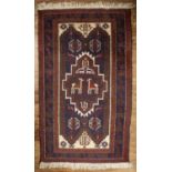 Blue and rust ground rug Pakistan, with central panel and foliate border, 143cm x 89cm Very light