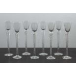 Set of eight drinking glasses 20th Century with wrythen twist stem, 22cm high (8)One with minute