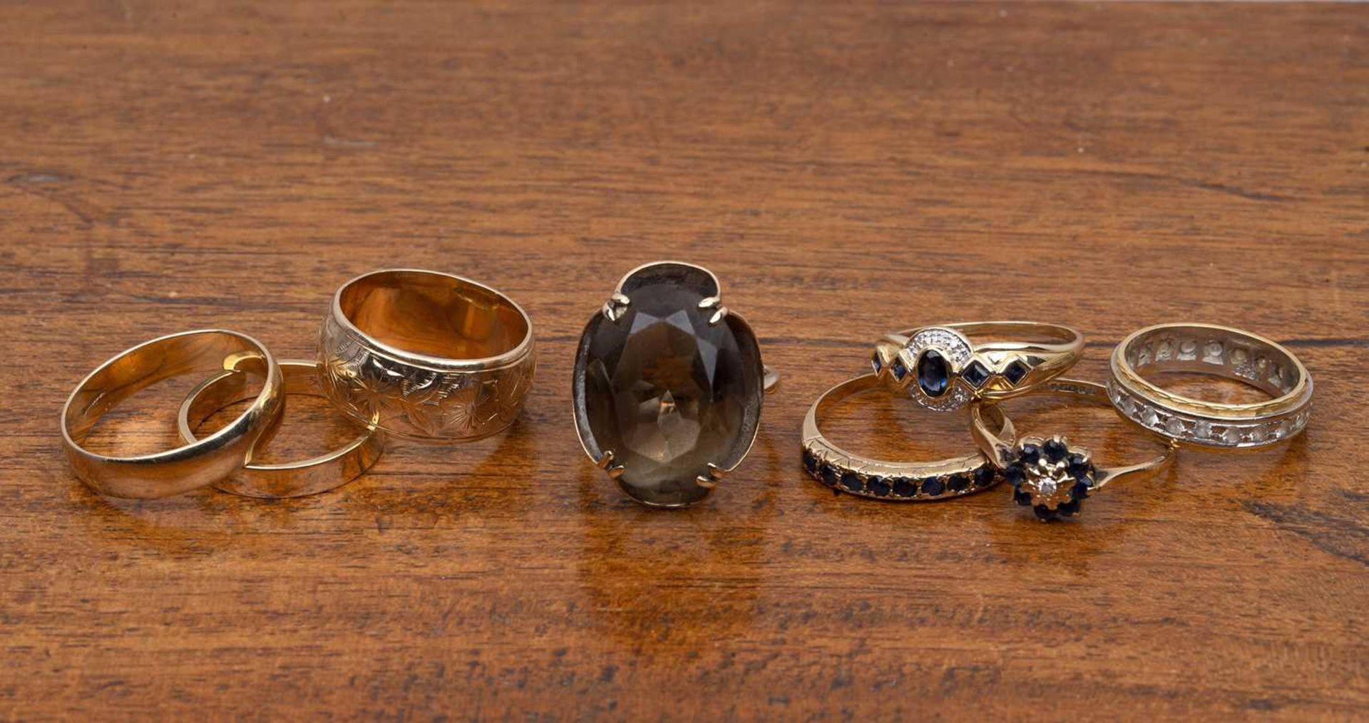 Collection of gold rings comprising of: five 9ct gold rings including a large band engraved with
