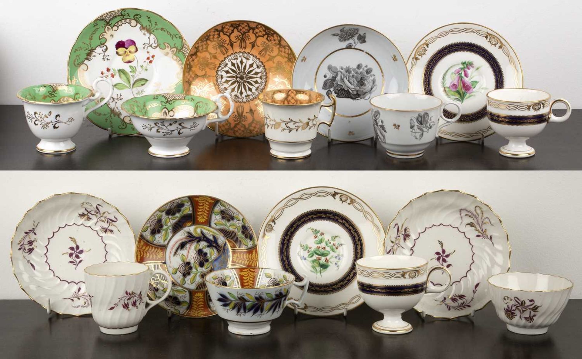 Group of porcelain teacups and saucers and a trio English, 19th Century, including monochrome