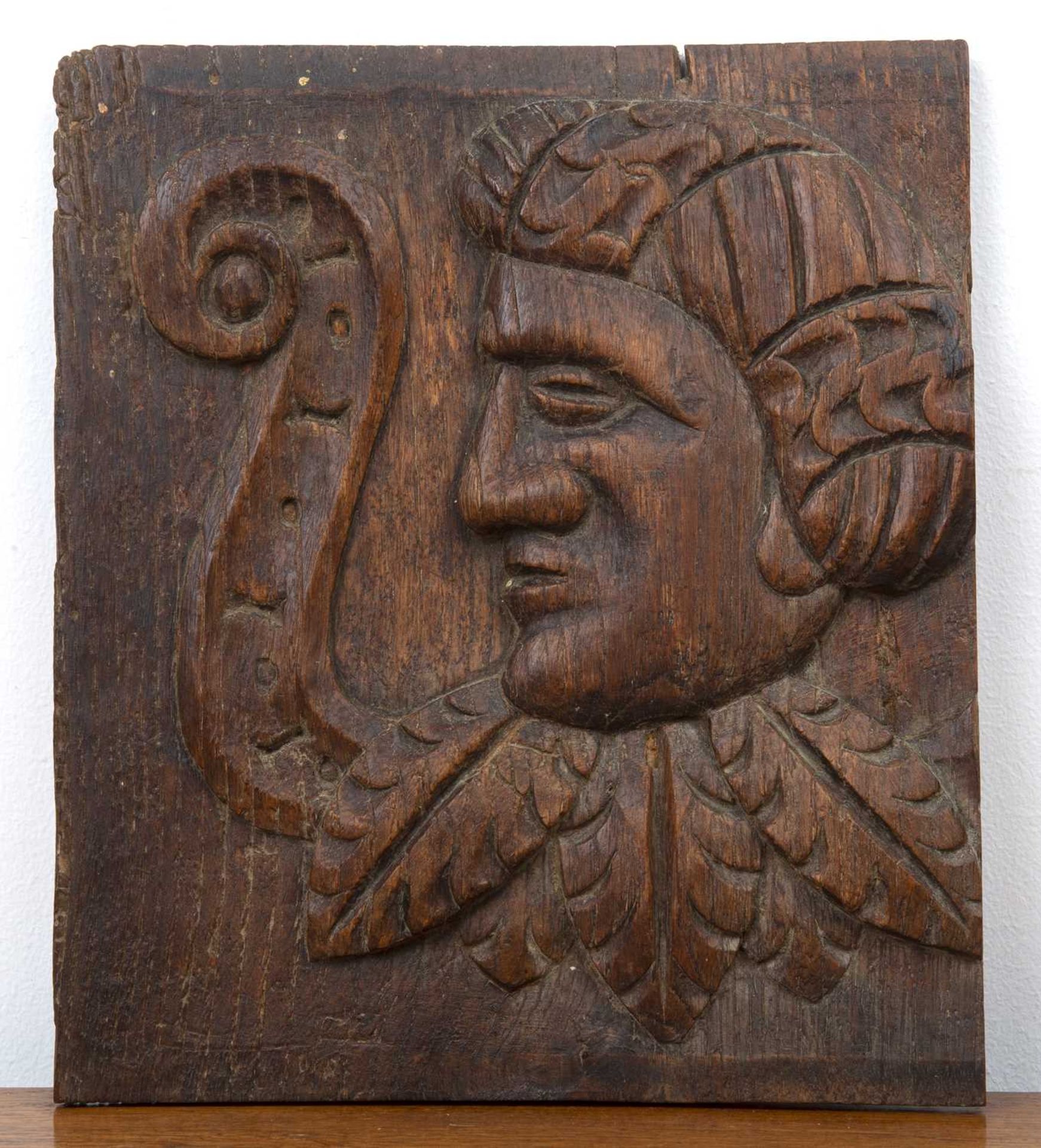 Continental carved oak panel 19th Century or later, with detail of a portrait in relief, unsigned,