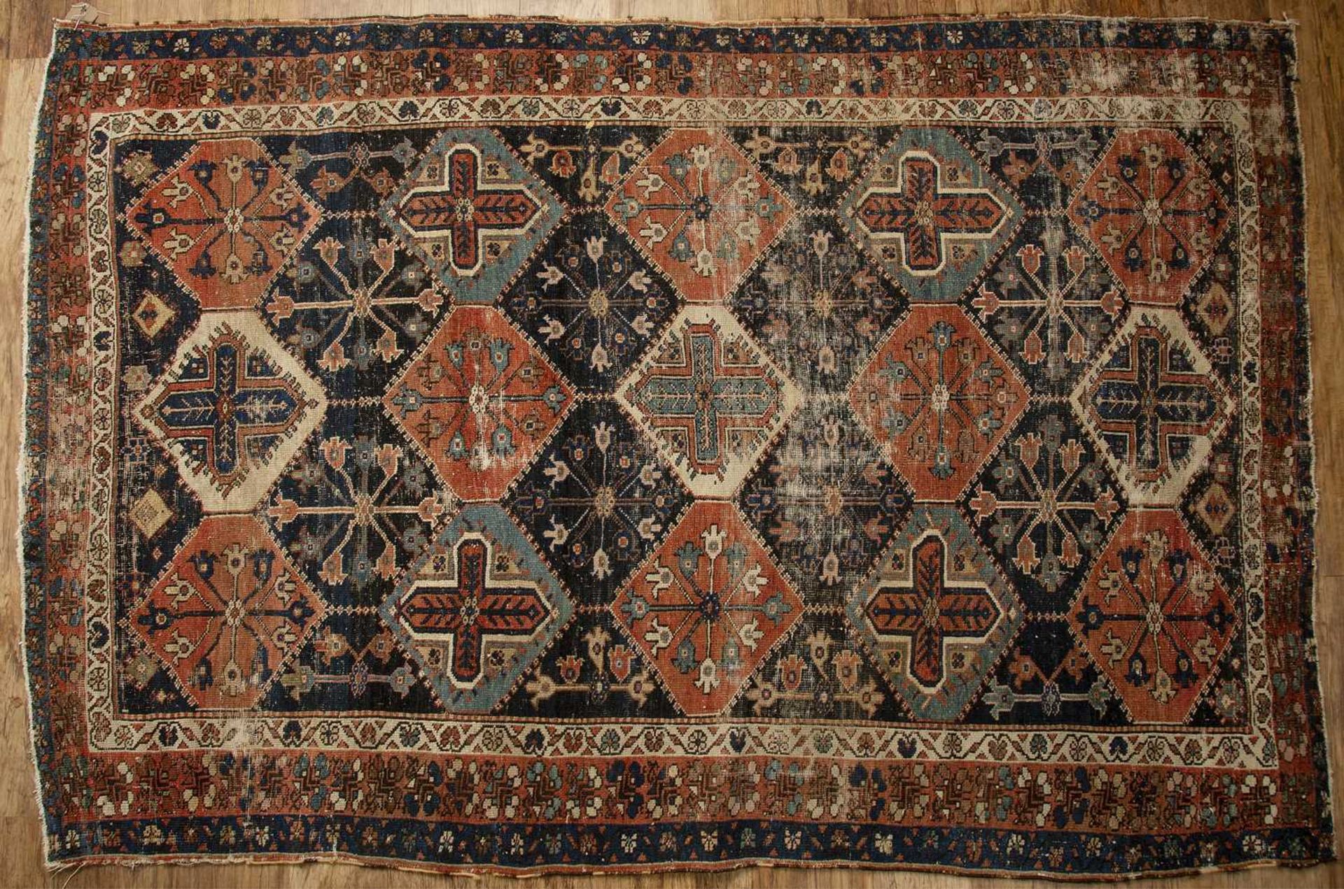Multicoloured rug Caucasian, with overall geometric design, 206cm x 136cmWorn and with losses.