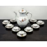 Set of nine Herend cabinet cups and saucers decorated with flowers and gilt decoration and a