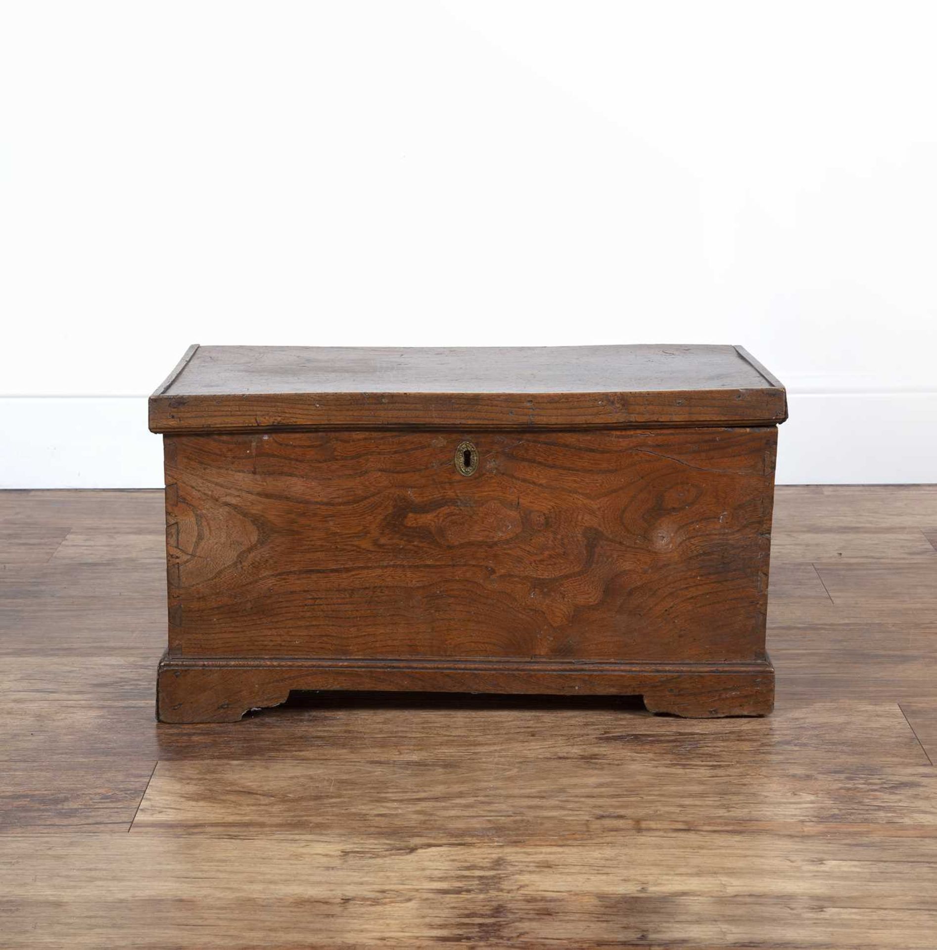 Elm coffer or chest of small proportions, 19th Century, with brass handles, standing on bracket