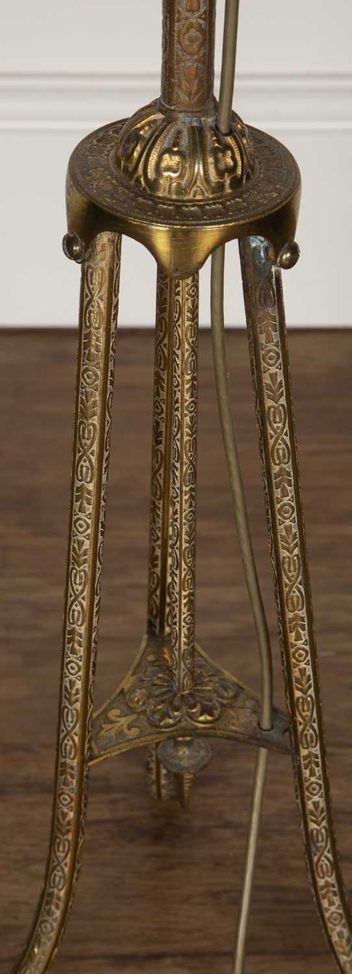 Brass standard lamp 20th Century, with repeating scrolling motifs, standing on a tripod base, - Image 3 of 4