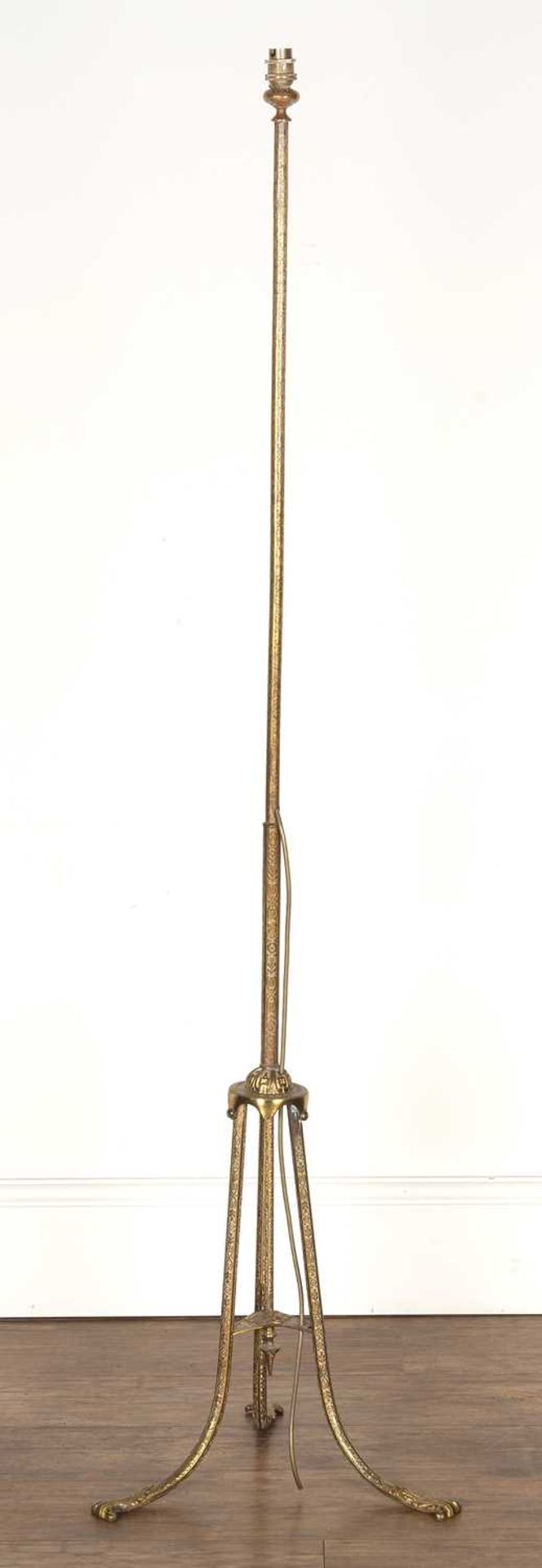 Brass standard lamp 20th Century, with repeating scrolling motifs, standing on a tripod base, - Image 2 of 4