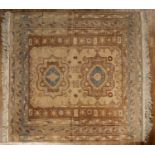 Two similar ivory ground rugs Pakistan, one with foliate designs, the other with two medallions,