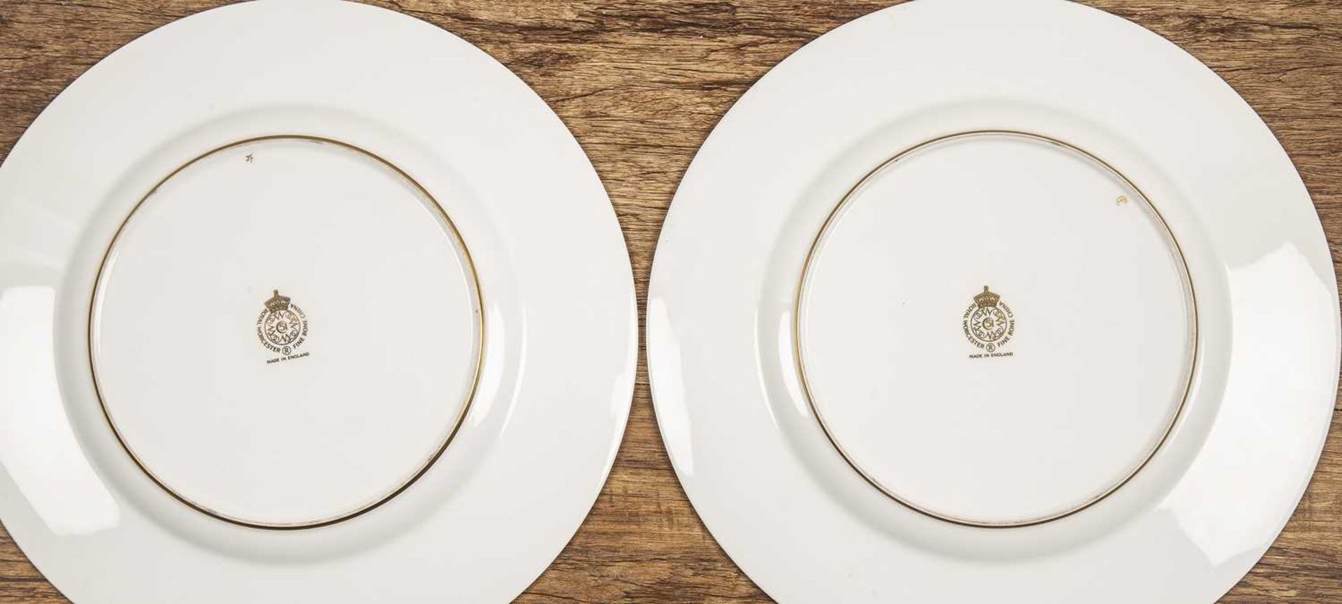 Pair of Royal Worcester porcelain cabinet plates the central panels with still life of fruit, signed - Image 2 of 2